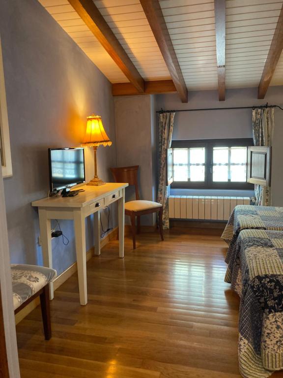 Cama o camas de una habitación en Posada La Casona de Los Güelitos