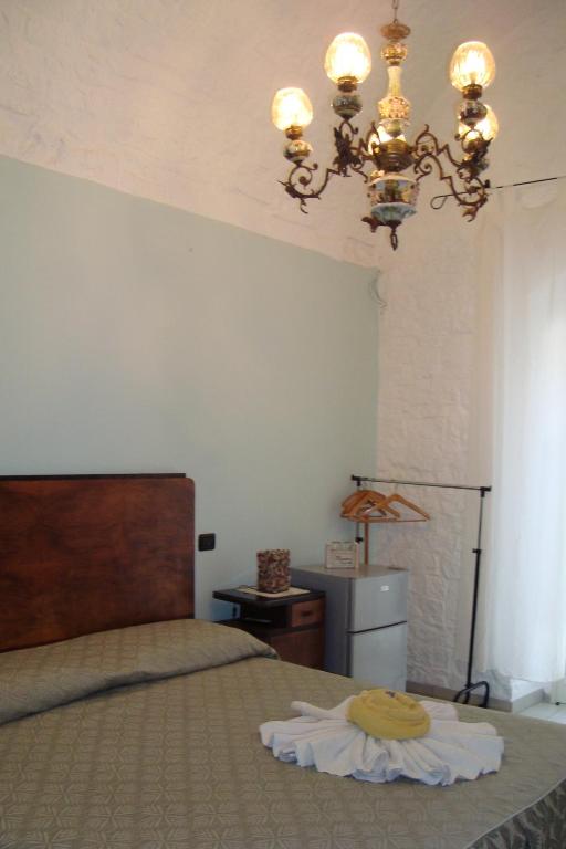 Postel nebo postele na pokoji v ubytování Masseria SD di Manchisi