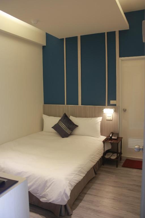 Postel nebo postele na pokoji v ubytování Prince Hotel