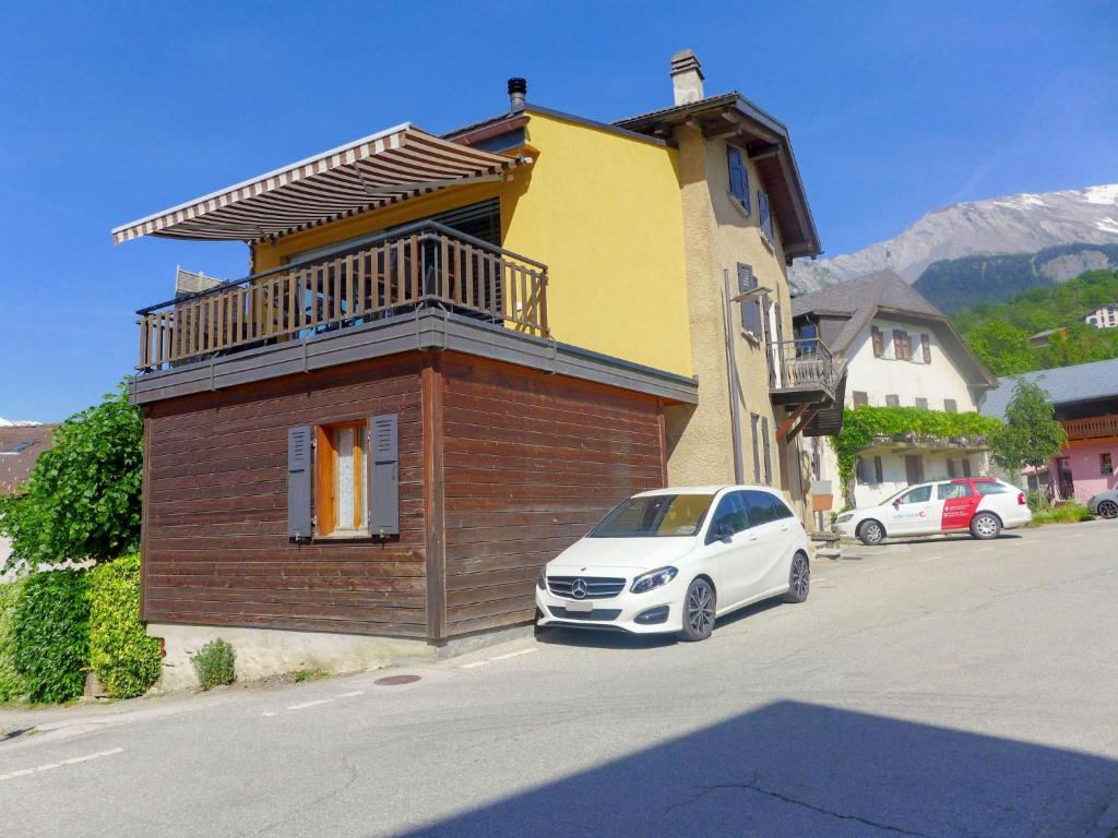 a white car parked in front of a building at Apartment Tilleul by Interhome in Grimisuat