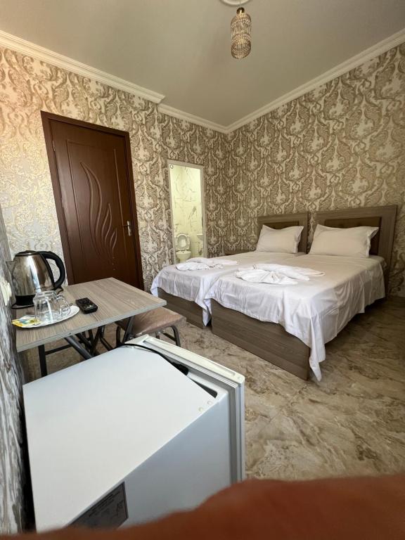Postel nebo postele na pokoji v ubytování hotel Vaxx