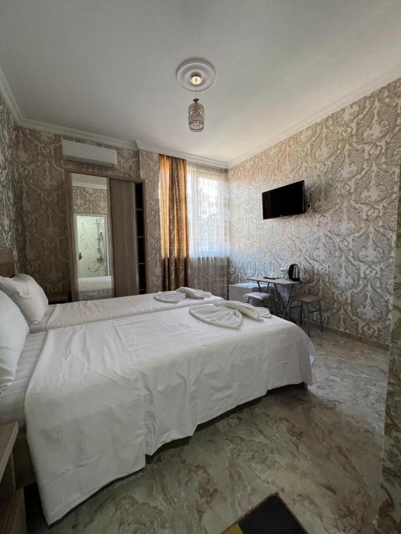 Postel nebo postele na pokoji v ubytování hotel Vaxx