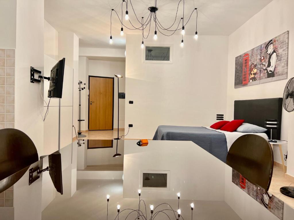 Telewizja i/lub zestaw kina domowego w obiekcie Viale Umberto I Apartments