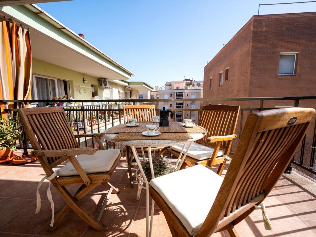 a patio with a table and chairs on a balcony at Apartment Riumar by Interhome in Segur de Calafell