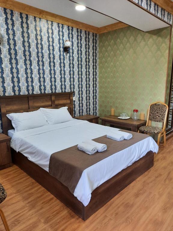Postel nebo postele na pokoji v ubytování Hotel LU-MA