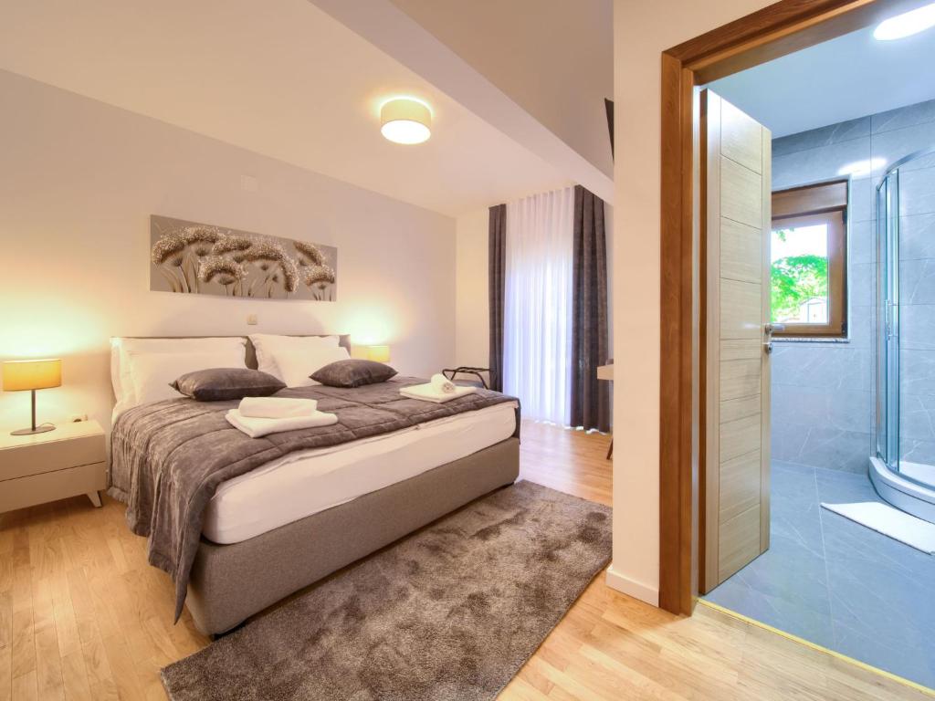 Postel nebo postele na pokoji v ubytování Holiday Home Magna Tilia by Interhome