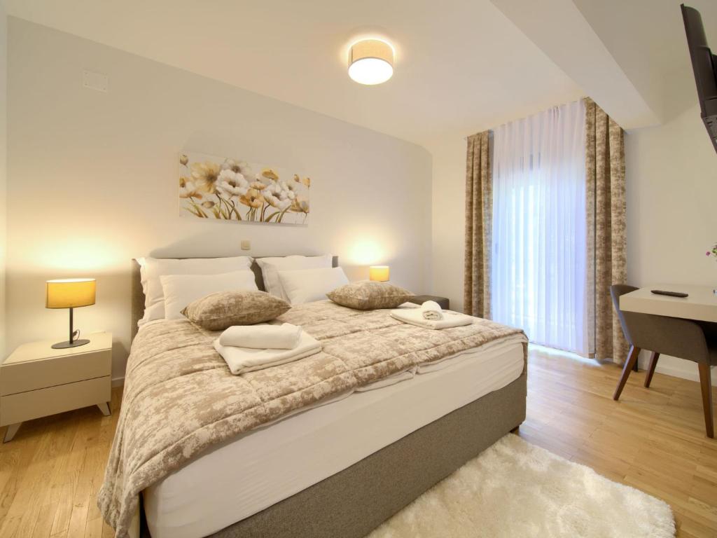 Postel nebo postele na pokoji v ubytování Holiday Home Magna Tilia by Interhome