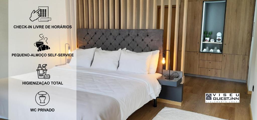 een slaapkamer met een bed met een witte sprei bij Viseu Guest Inn in Viseu