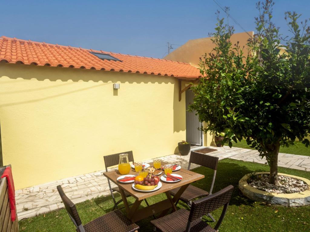 a table with plates of food on it in a yard at Villa Riviera by Interhome in Sintra