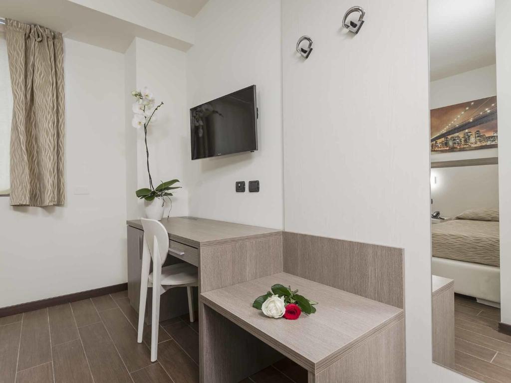 TV a/nebo společenská místnost v ubytování Ferrari Hotel