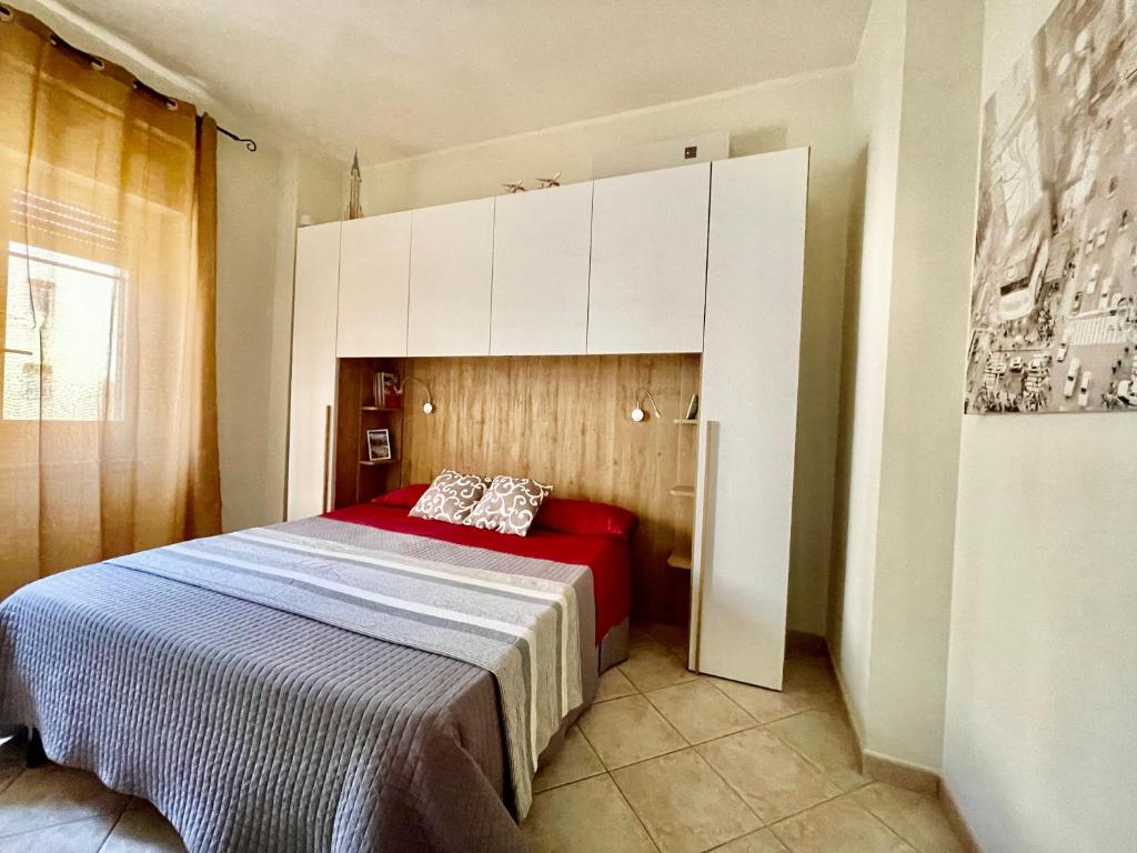 Łóżko lub łóżka w pokoju w obiekcie Viale Umberto I Apartments