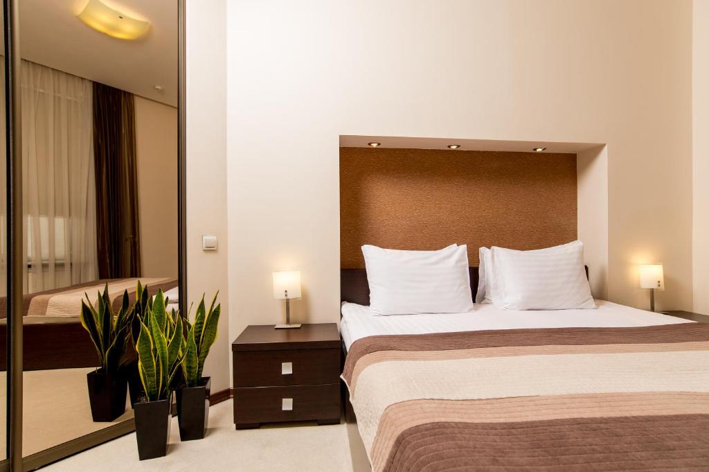 Postel nebo postele na pokoji v ubytování Incognito Boutique Hotel