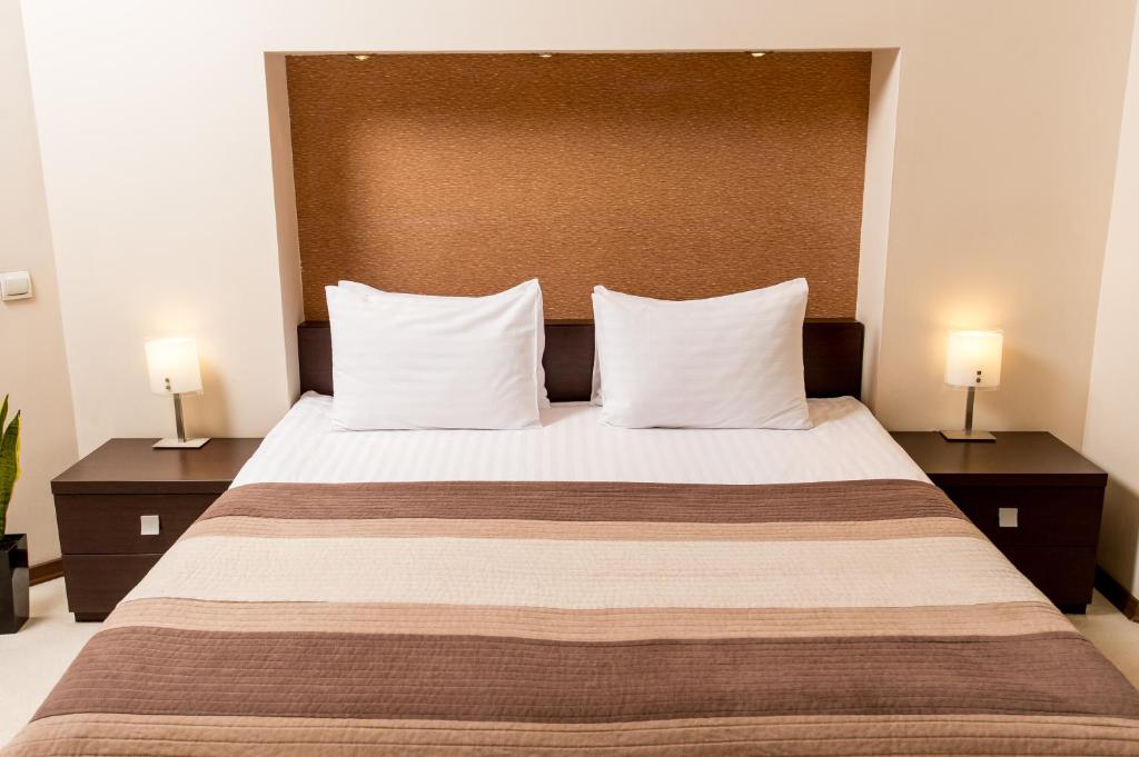 Postel nebo postele na pokoji v ubytování Incognito Boutique Hotel