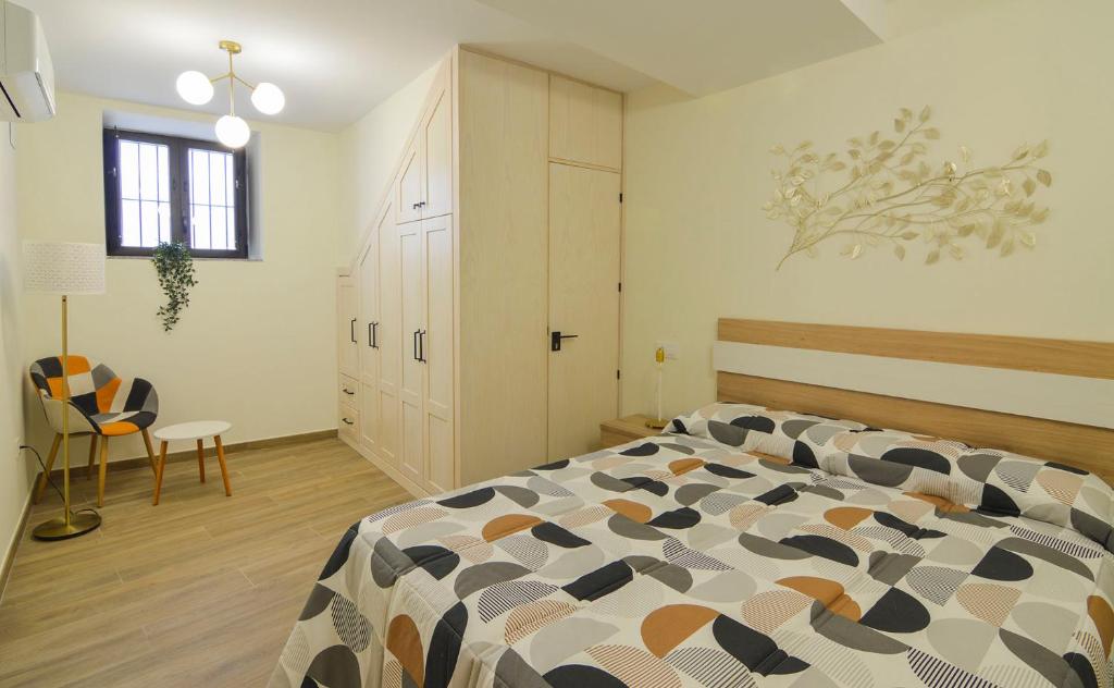 Posteľ alebo postele v izbe v ubytovaní Apartamentos Turísticos Hornillo AT-CC-00681