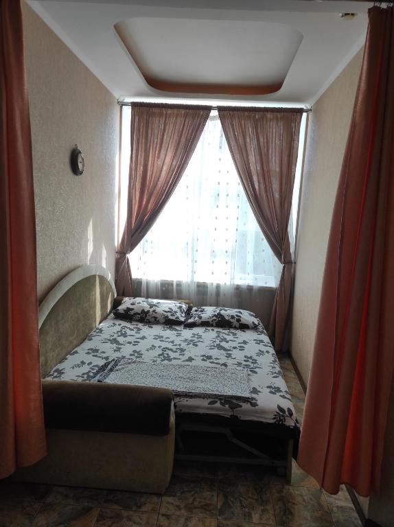 Postel nebo postele na pokoji v ubytování Apart-otel'"Tsarskoe-selo"