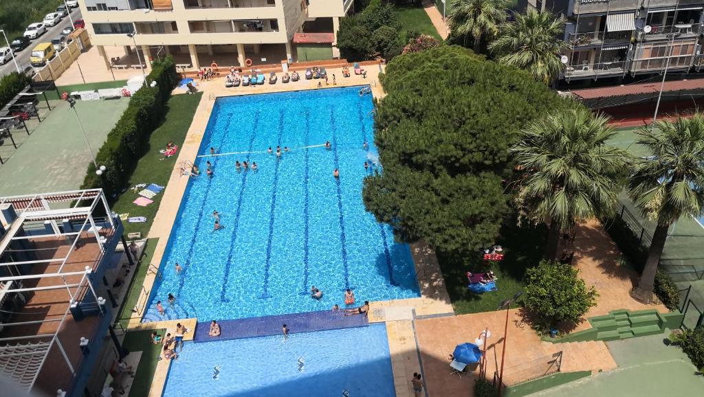Bazén v ubytování Espectacular apartment con piscina, vistas al mar y tranquilidad 10 min desde Valencia nebo v jeho okolí