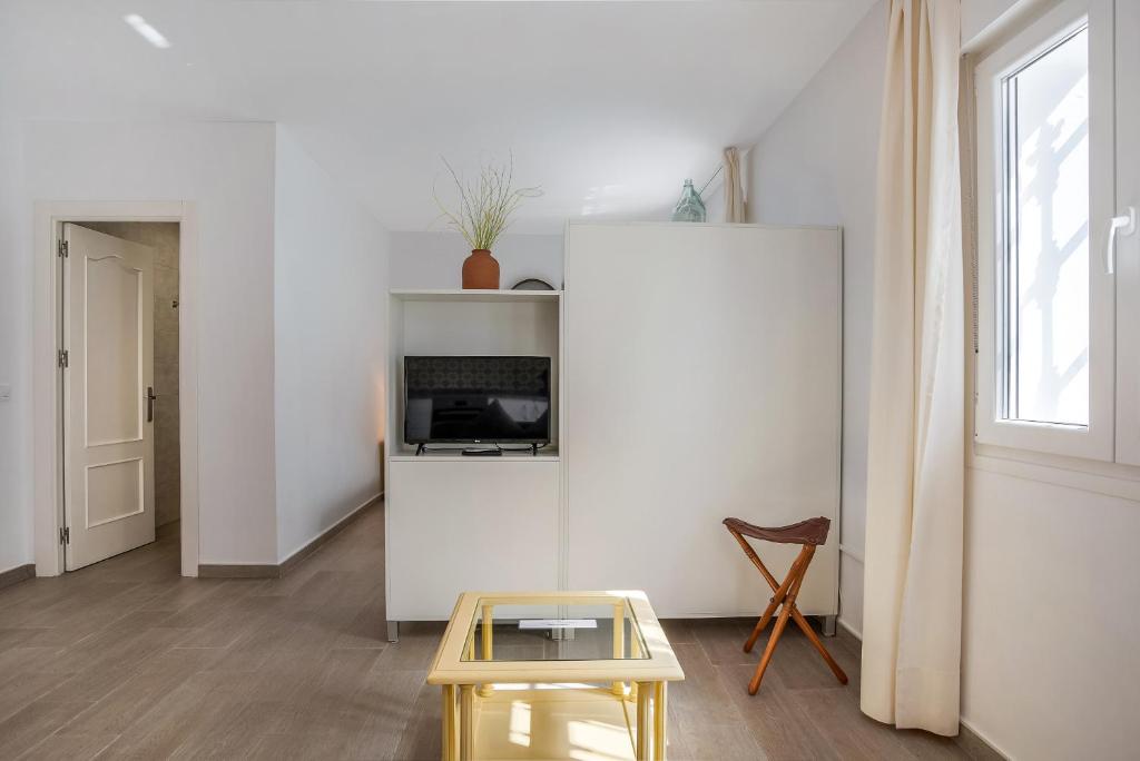 Televízia a/alebo spoločenská miestnosť v ubytovaní Casa de 10 - 4 Interior