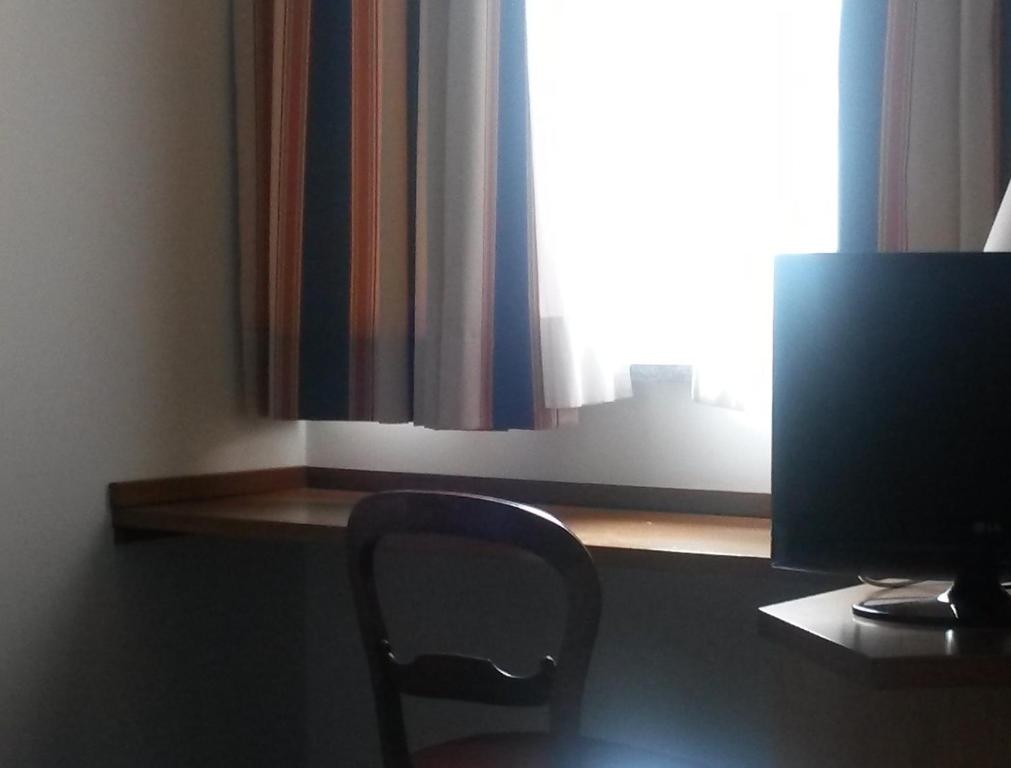 TV a/nebo společenská místnost v ubytování Cravero Rooms