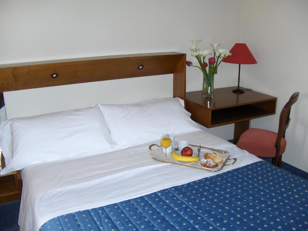 Postel nebo postele na pokoji v ubytování Cravero Rooms