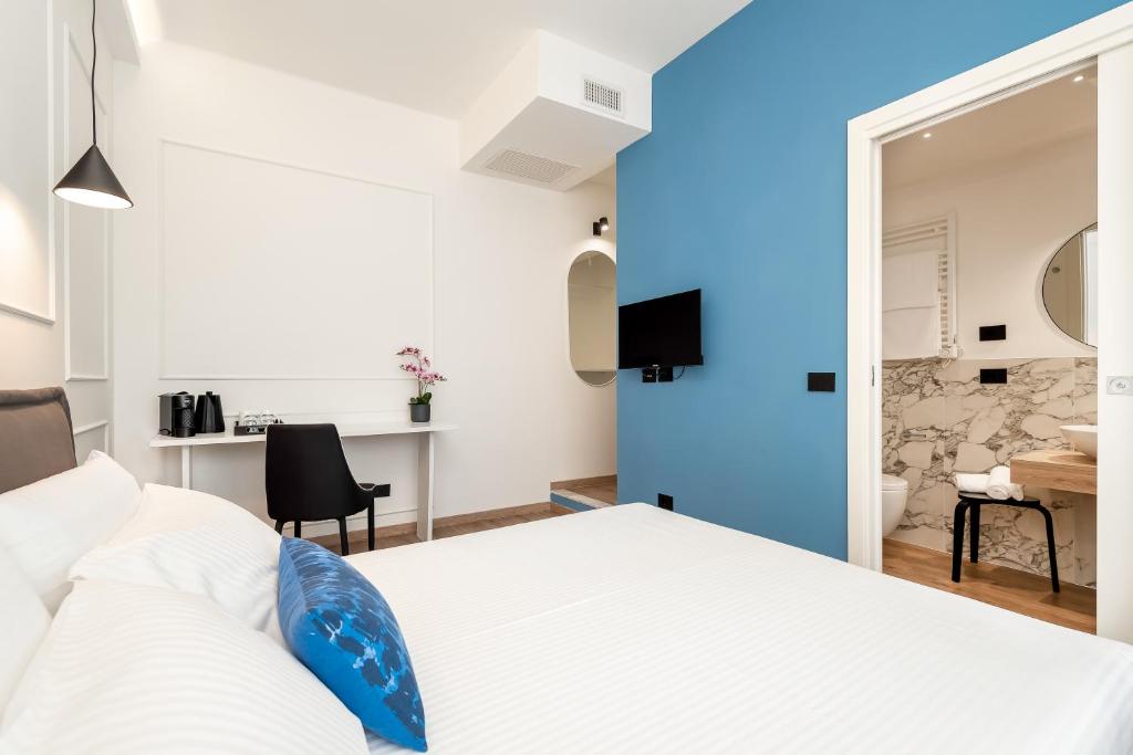 Posteľ alebo postele v izbe v ubytovaní Nelli Rooms Via Veneto