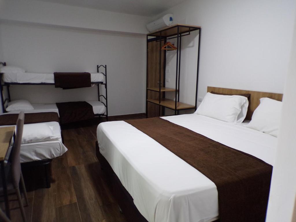 Posteľ alebo postele v izbe v ubytovaní Hotel Nord Est