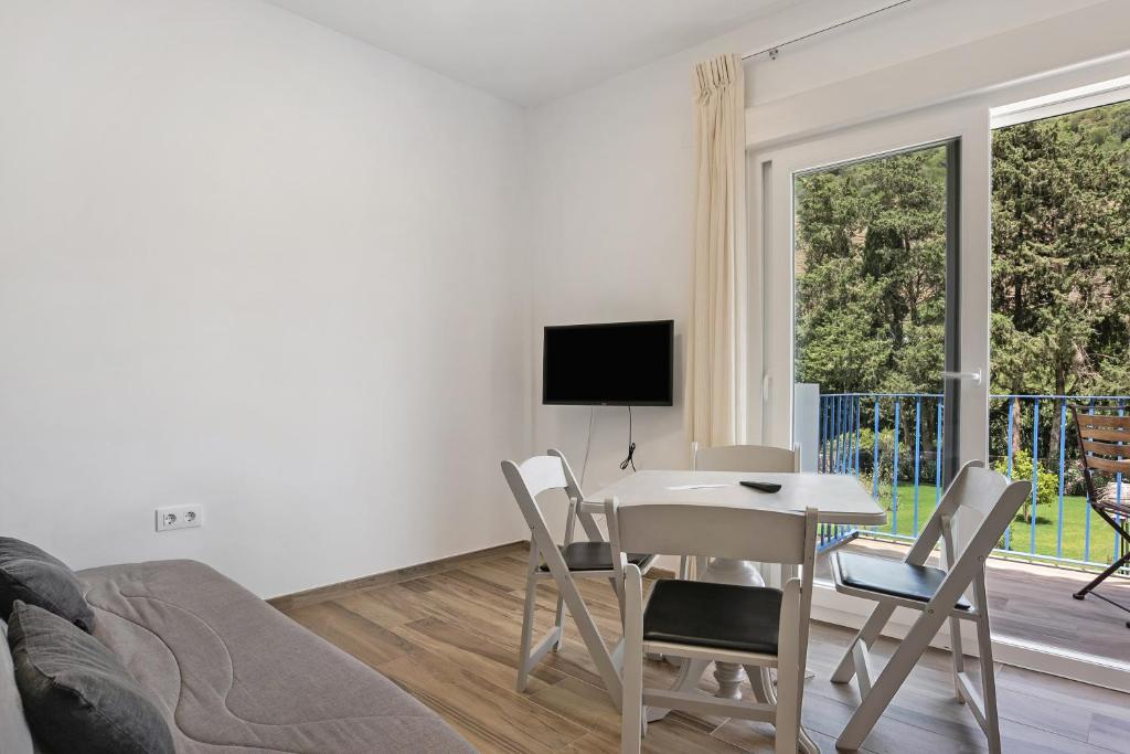 Televízia a/alebo spoločenská miestnosť v ubytovaní Casa de 10 - 3a