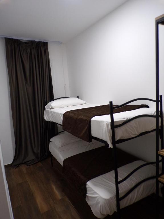 Posteľ alebo postele v izbe v ubytovaní Hotel Nord Est