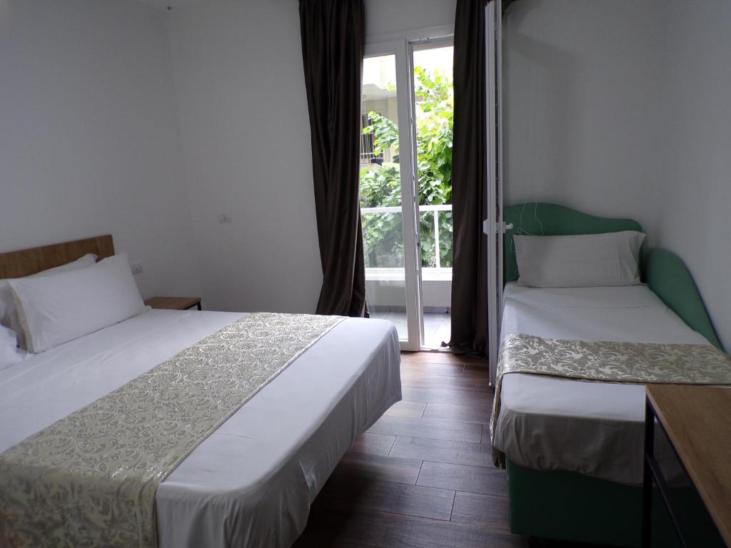 Posteľ alebo postele v izbe v ubytovaní Hotel Nord Est