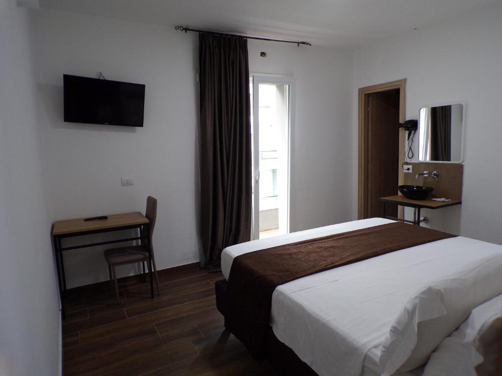 Posteľ alebo postele v izbe v ubytovaní Hotel Nord Est