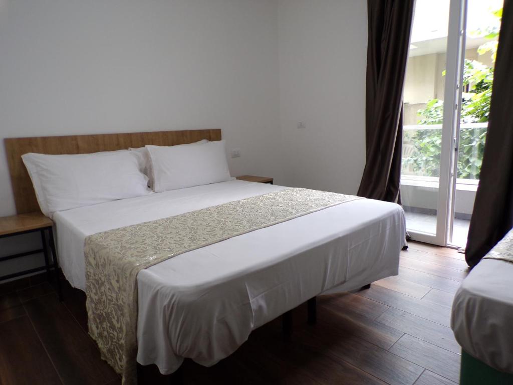 Posteľ alebo postele v izbe v ubytovaní Hotel Nord Est