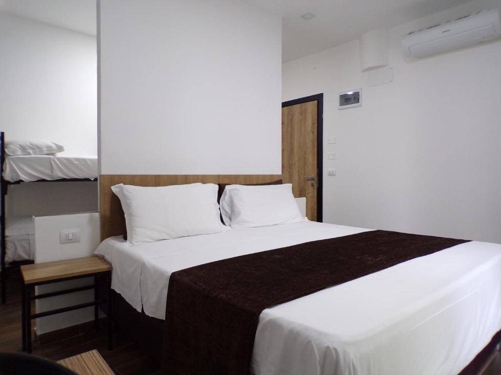 Posteľ alebo postele v izbe v ubytovaní Hotel Nord Est