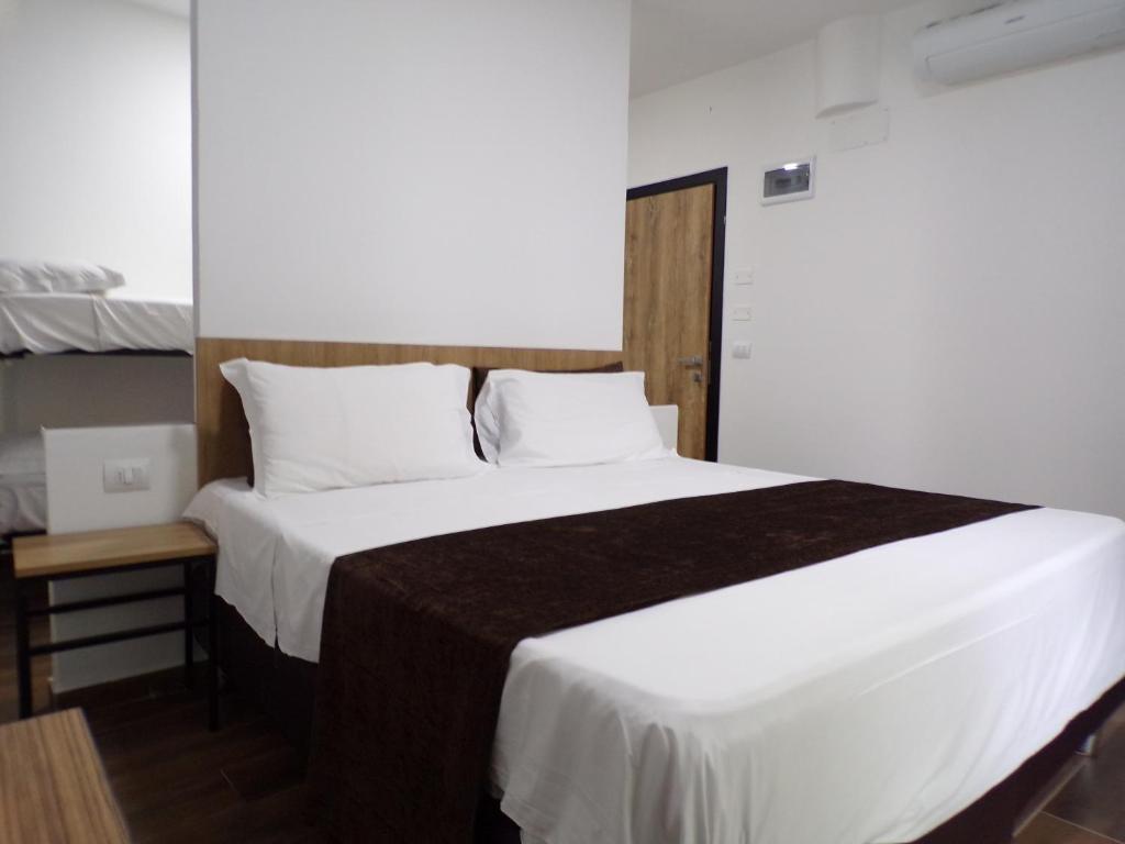 Posteľ alebo postele v izbe v ubytovaní Hotel Nord Est