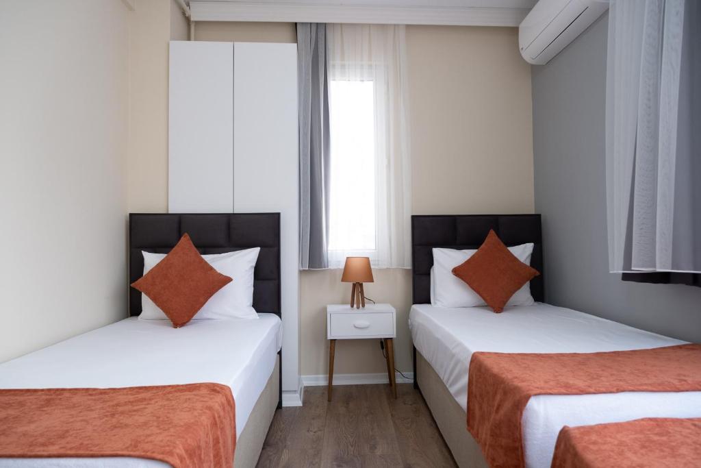 Кровать или кровати в номере GREEN SUITES BURSA