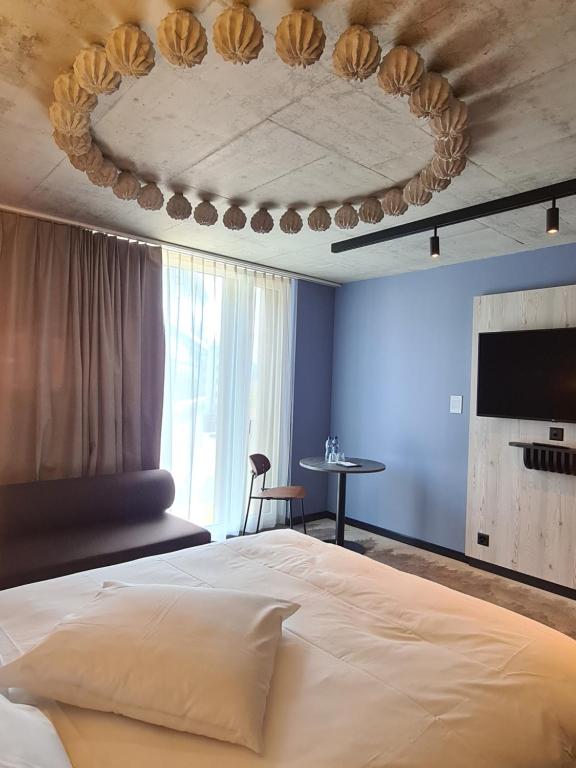 Postel nebo postele na pokoji v ubytování Mercure Hotel Delémont