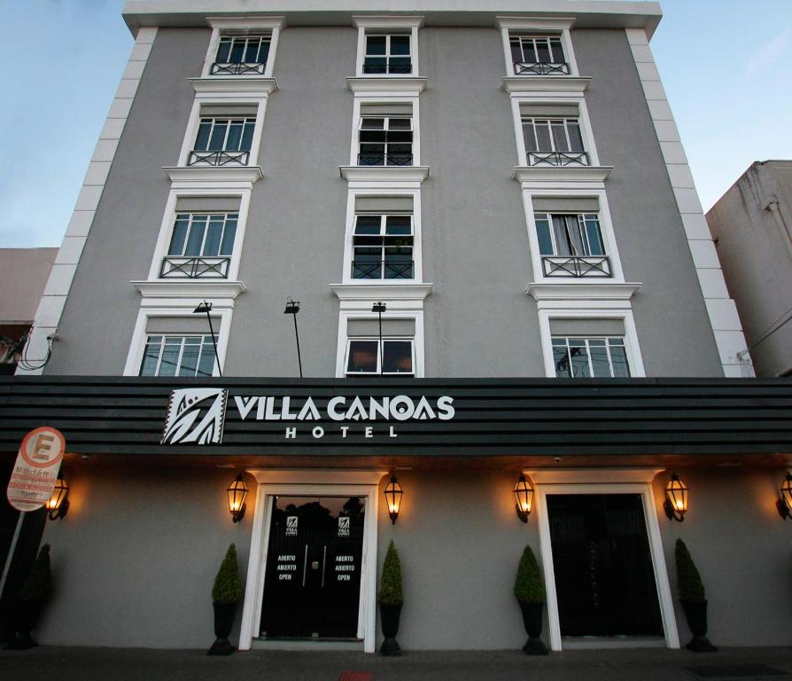 a building with a sign that reads villa canandal at VOA Villa Canoas in Foz do Iguaçu
