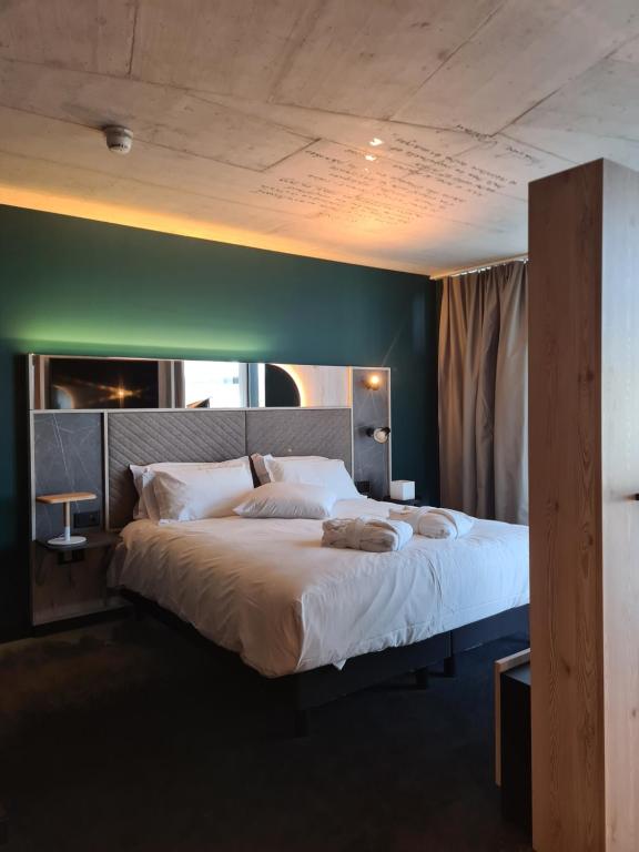 Postel nebo postele na pokoji v ubytování Mercure Hotel Delémont