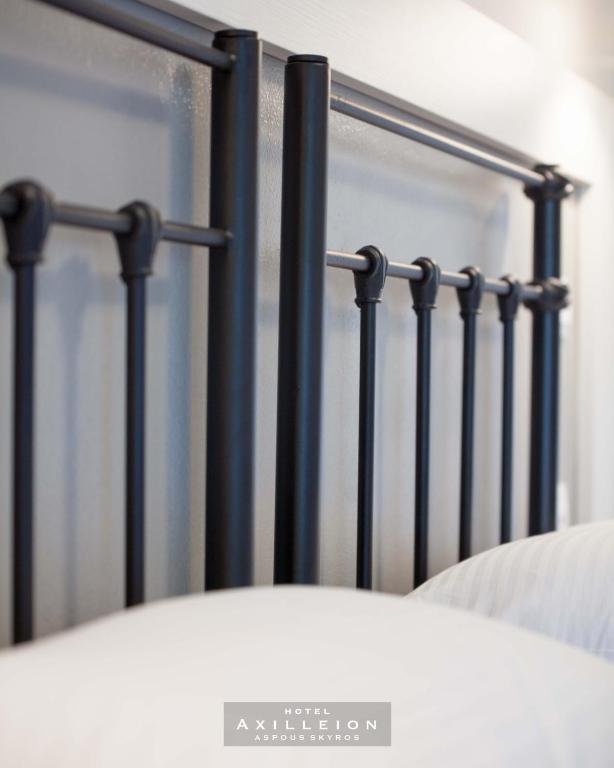 Postel nebo postele na pokoji v ubytování Achilleion Hotel