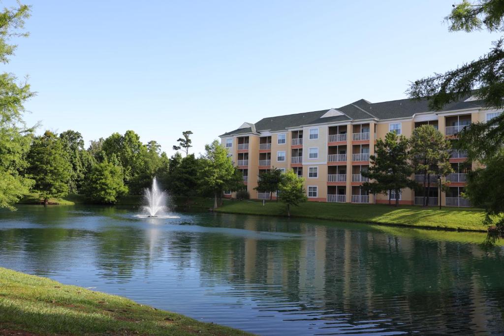 a building with a fountain in the middle of a lake at Unit at the Sheraton Broadway Plantation in Myrtle Beach