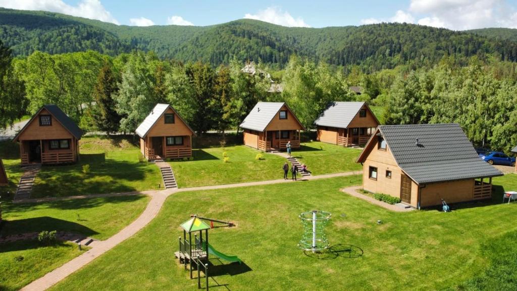 an aerial view of a village with a playground at Przystanek Krzywe in Cisna