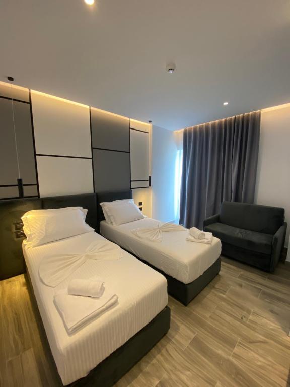 Postel nebo postele na pokoji v ubytování ADMIRO Hotel