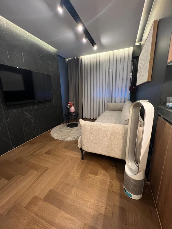 a bedroom with a bed and a tv in it at Black Diamond in Zurich
