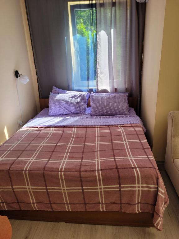A bed or beds in a room at Studio VIP-ZONE
