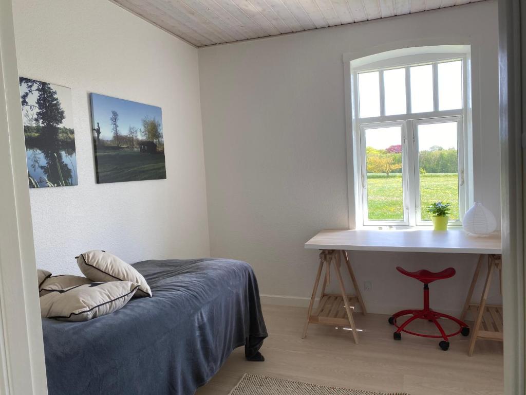 Postel nebo postele na pokoji v ubytování Hyggelig aftægtsbolig i hjertet af Sønderjylland