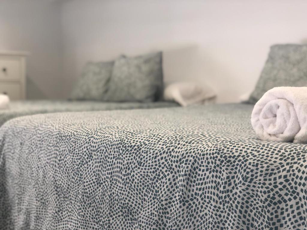Posteľ alebo postele v izbe v ubytovaní Apartamento López