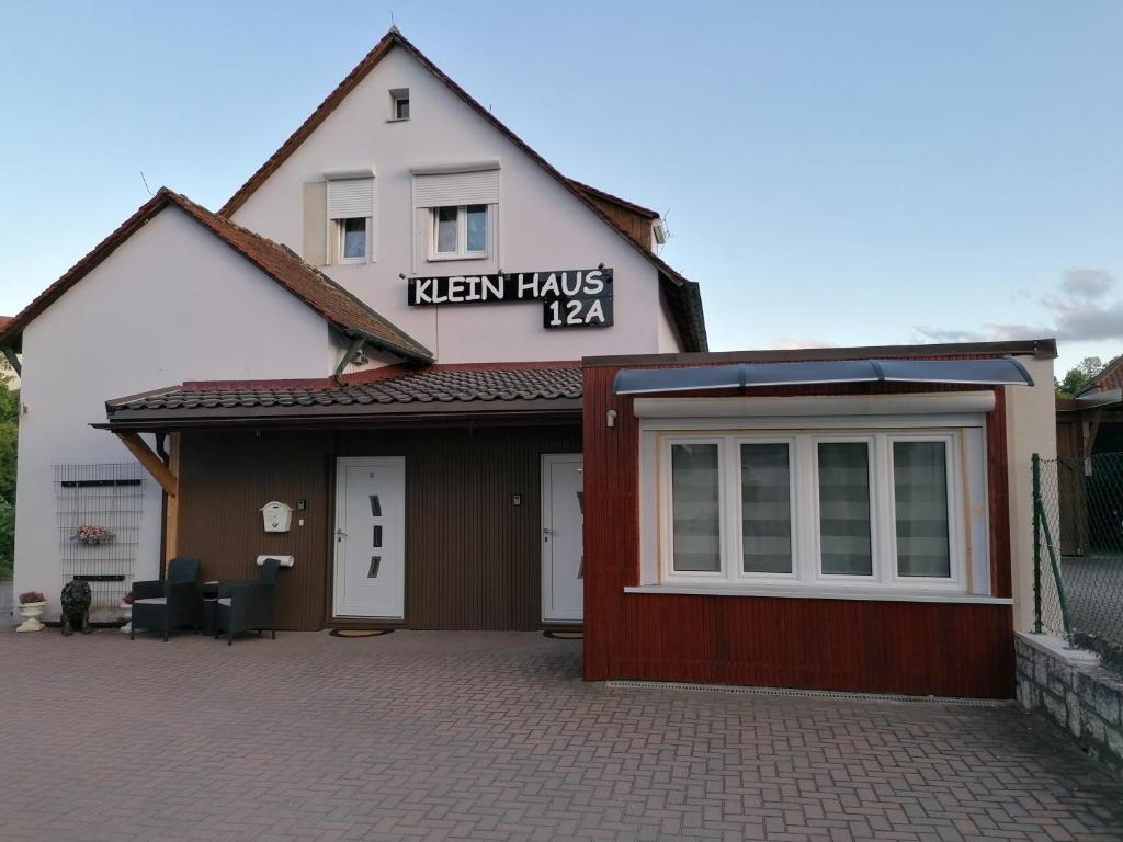 a building with a sign that reads tavern has aaa at Klein Haus 12A in Sulzbach-Rosenberg