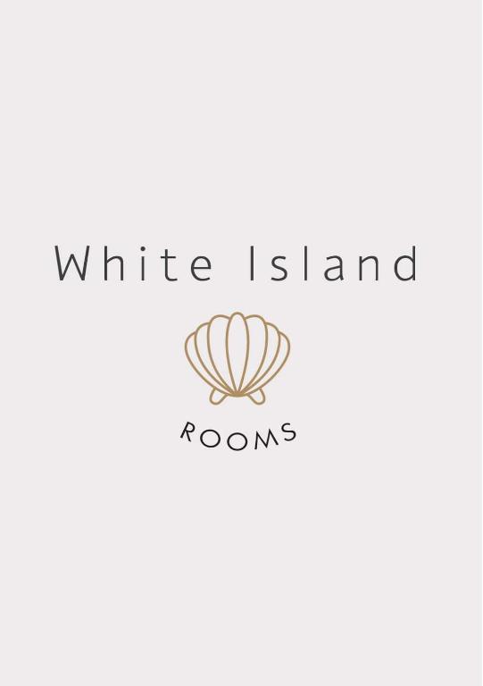 a logo for a white island condos at White island rooms in Panteli