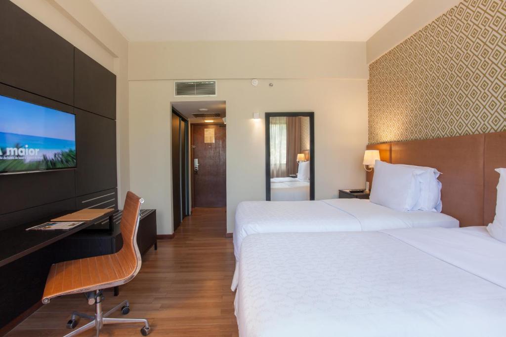 Postel nebo postele na pokoji v ubytování Wish Hotel da Bahia