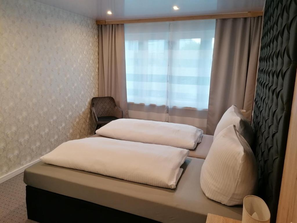 Postel nebo postele na pokoji v ubytování Klein Haus 12A