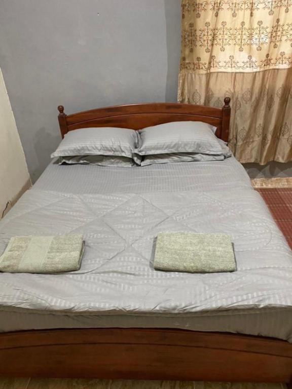 Postel nebo postele na pokoji v ubytování SMZ Café & Homestay - SELF CHECK IN