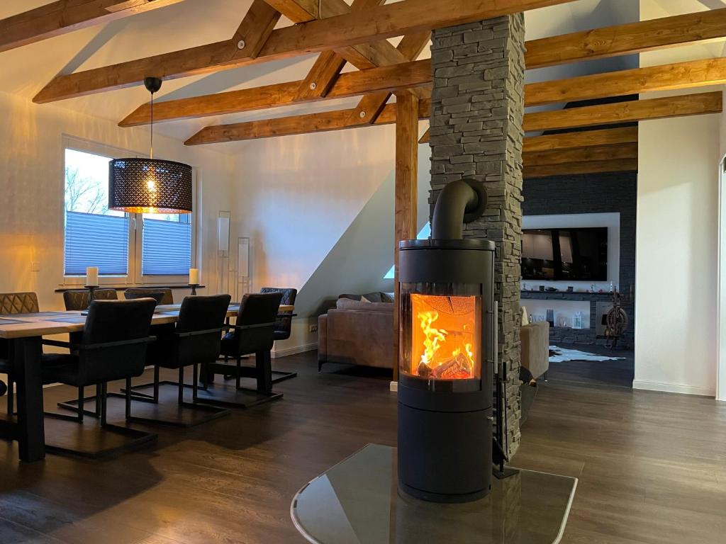 a fireplace in the living room of a house at Ferienwohnung Astrid in Alt Schwerin